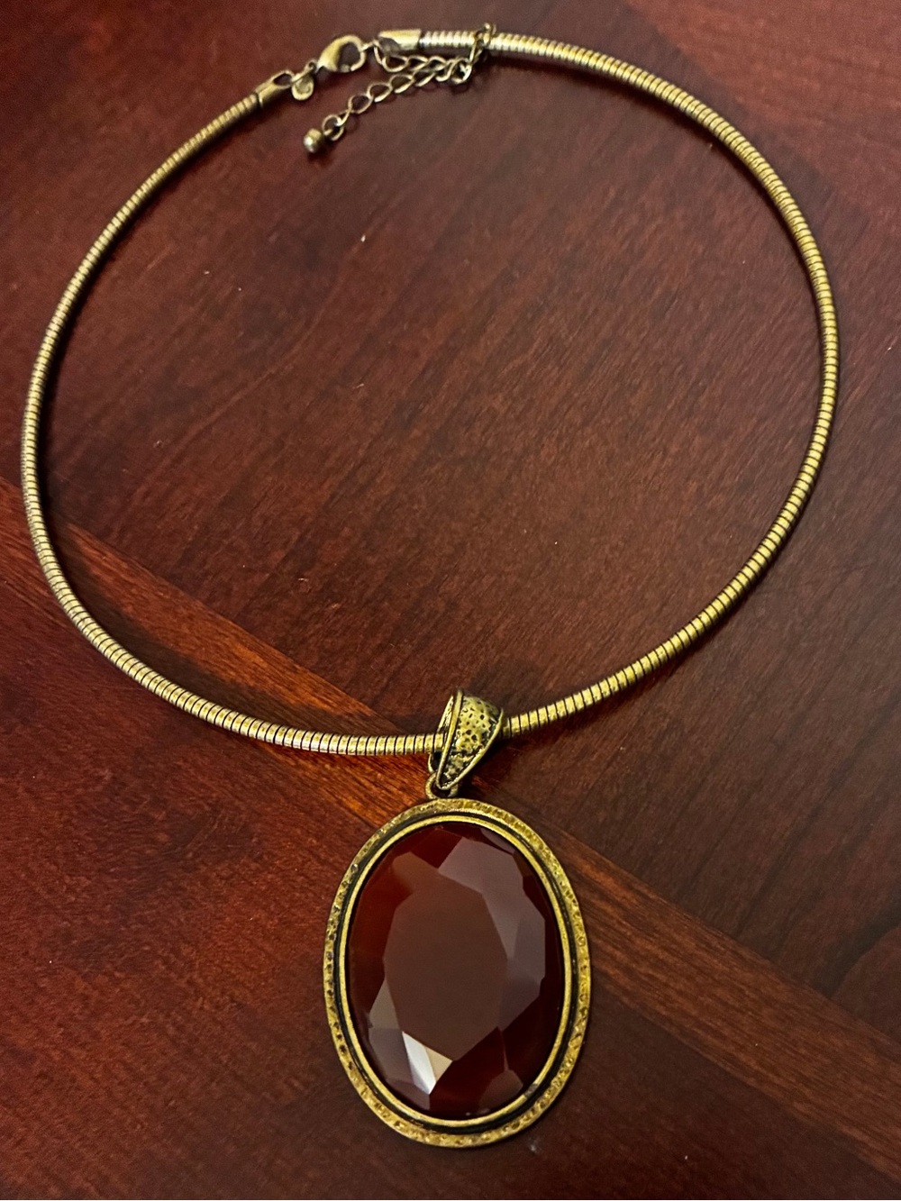 Premier Designs Gold-Tone Necklace with Faceted Garnet-Red Oval Pendant